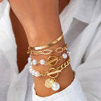 Chic Gold 4-Piece Bracelet Set – Snake, Pearls & Links | Gold-Westeryn