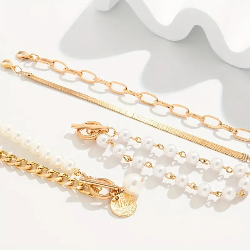 Chic Gold 4-Piece Bracelet Set – Snake, Pearls & Links | Gold-Westeryn