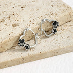 NOVA – Elegant Huggie Earrings with Heart & Paw in Silver Look and Black Enamel for a Stylish Appearance-Westeryn