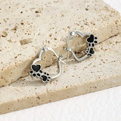 NOVA – Elegant Huggie Earrings with Heart & Paw in Silver Look and Black Enamel for a Stylish Appearance