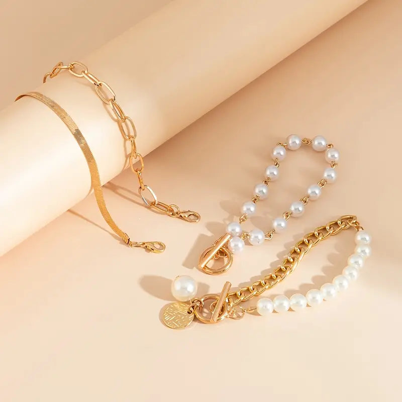 Chic Gold 4-Piece Bracelet Set – Snake, Pearls & Links | Gold-Westeryn