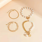 Chic Gold 4-Piece Bracelet Set – Snake, Pearls & Links | Gold-Westeryn